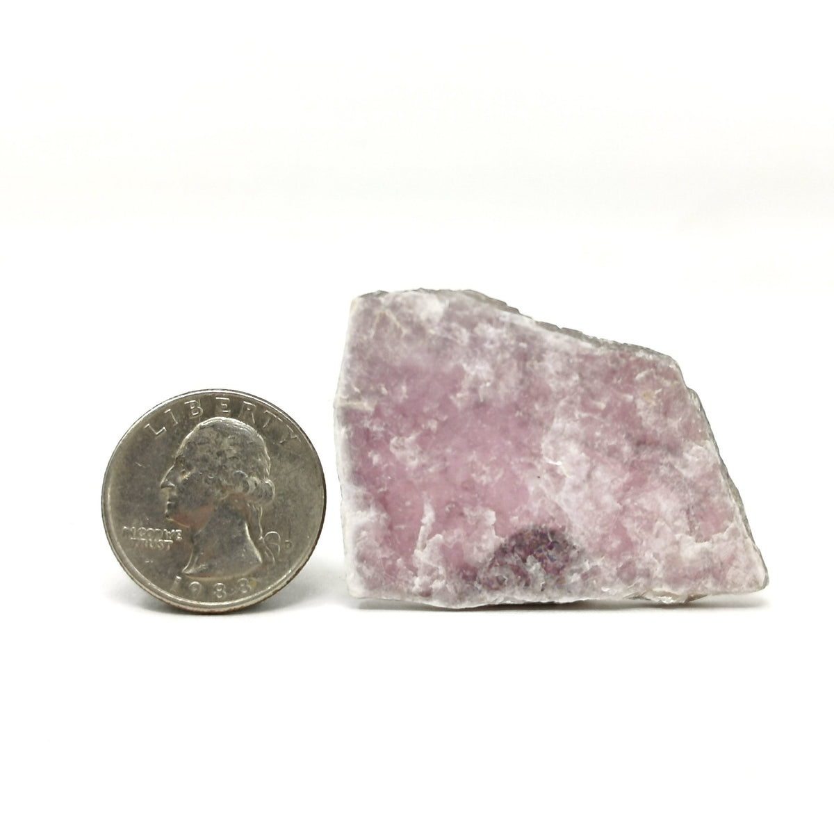 Lepidolite sheet specimen from Brazil – sheet beside a coin for scale