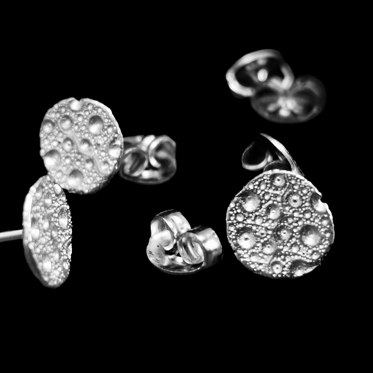 Moon earring in sterling silver.