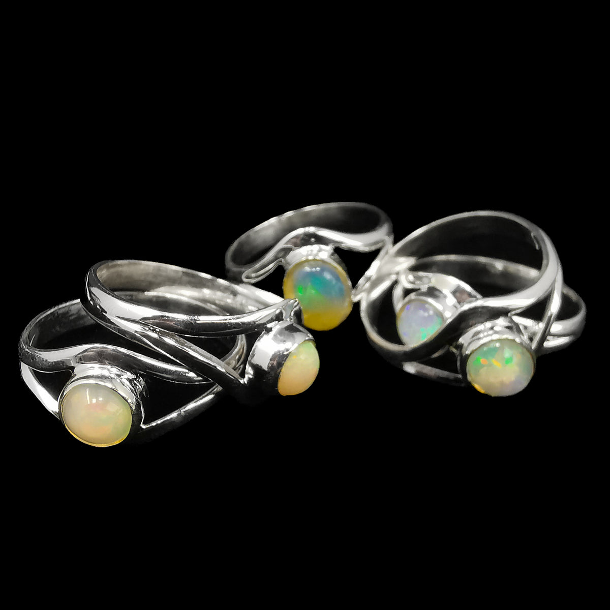 Opal split ring with Ethiopian opal – pile of rings