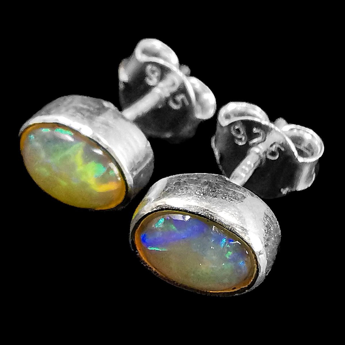Ethiopian opal oval stud earrings – pair, close-up of opal flash