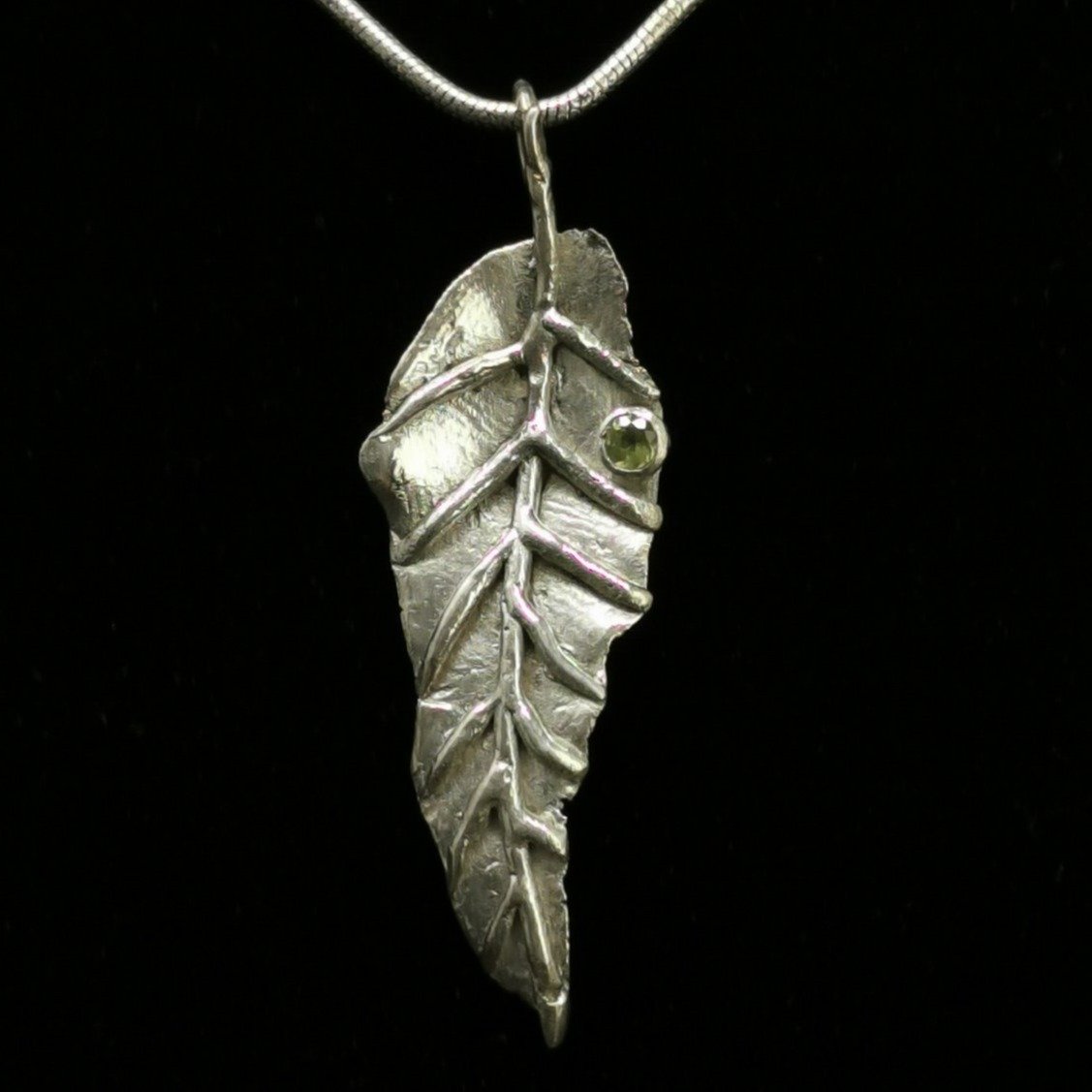 Peridot Leaf pendant in sterling silver with Faceted Peridot.