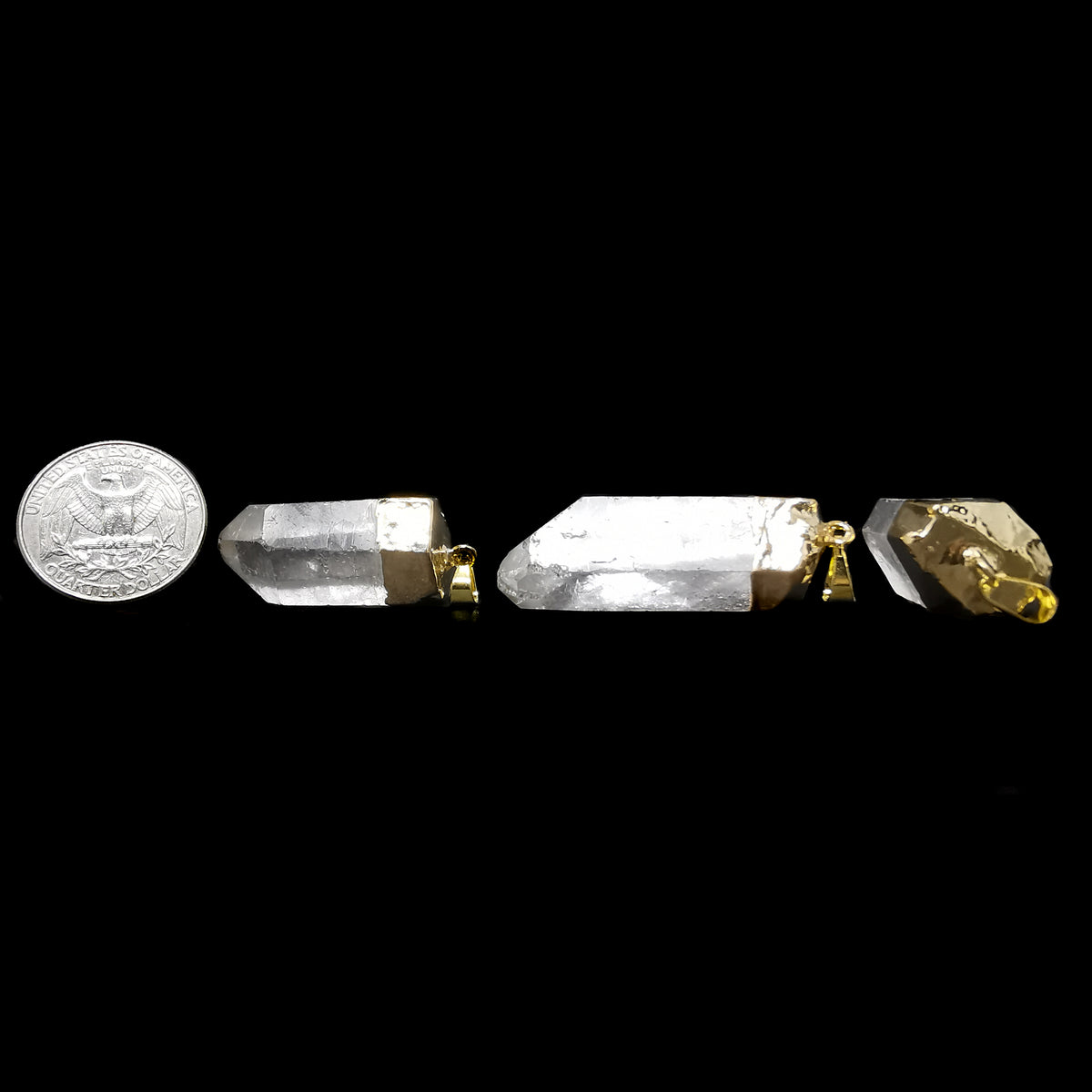Raw clear quartz point pendant – pendants beside a coin for scale