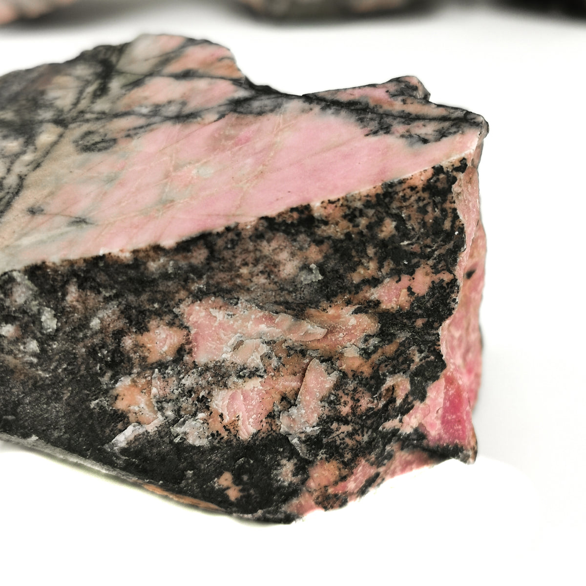 Rhodonite Pink rough, a manganese silicate.