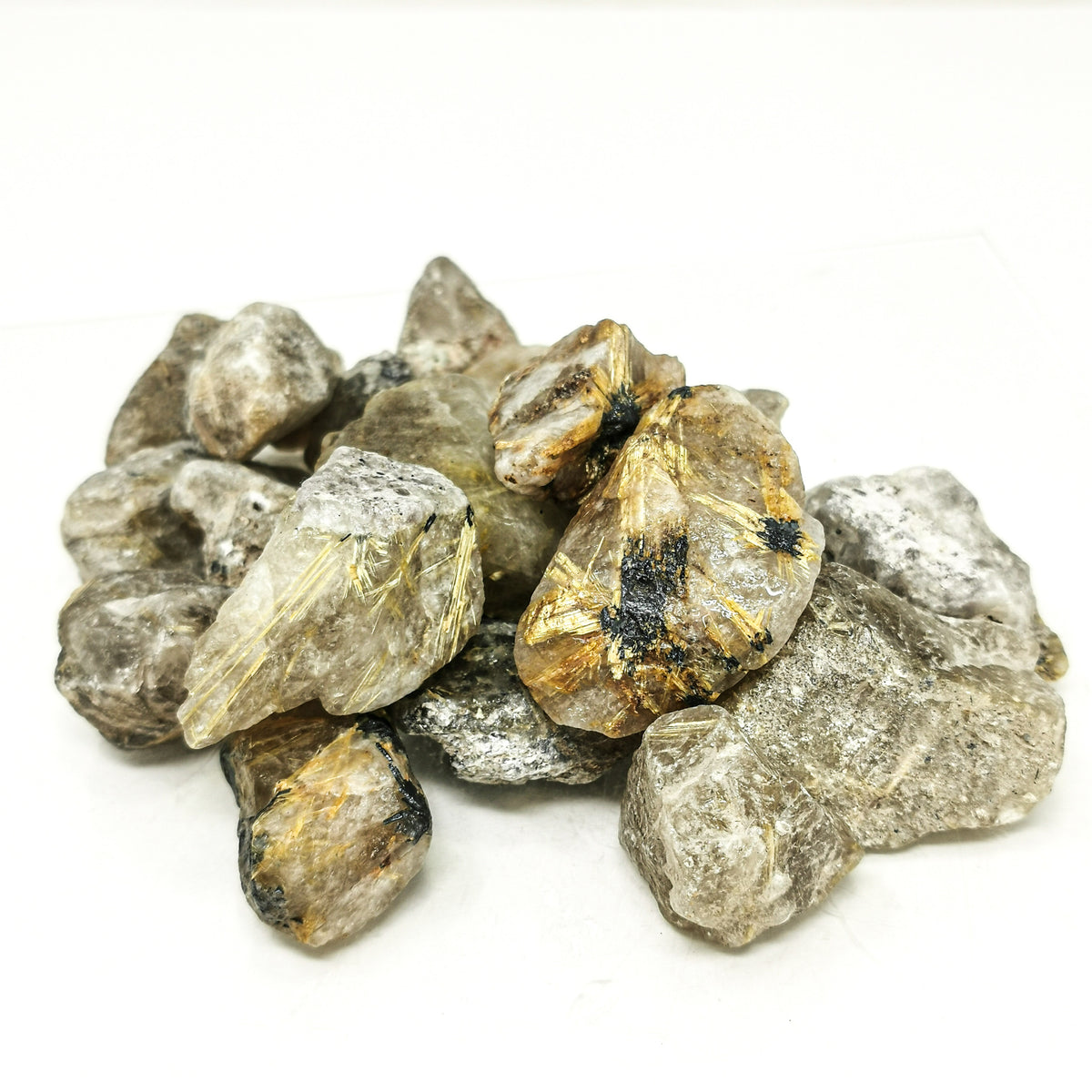 Rutile quartz rough from Bahia, Brazil – pile of rough pieces