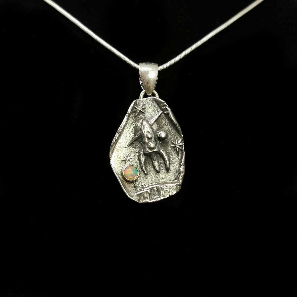 Rocket Ship Over Saturn pendant in sterling silver with Ethiopian Opal.