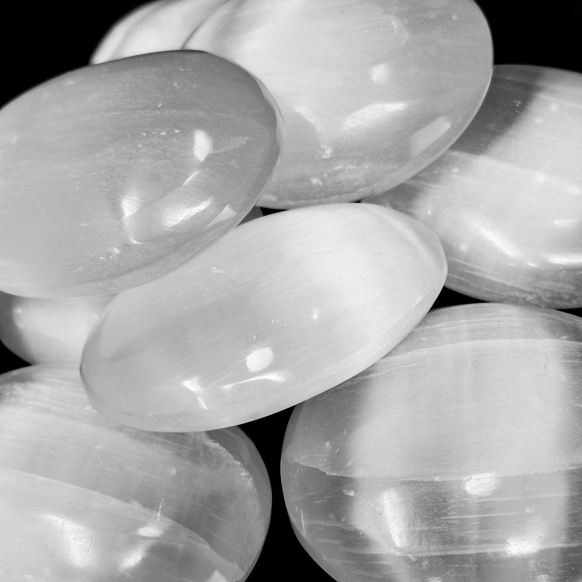 Selenite palm stone from Morocco – close-up of stacked stones