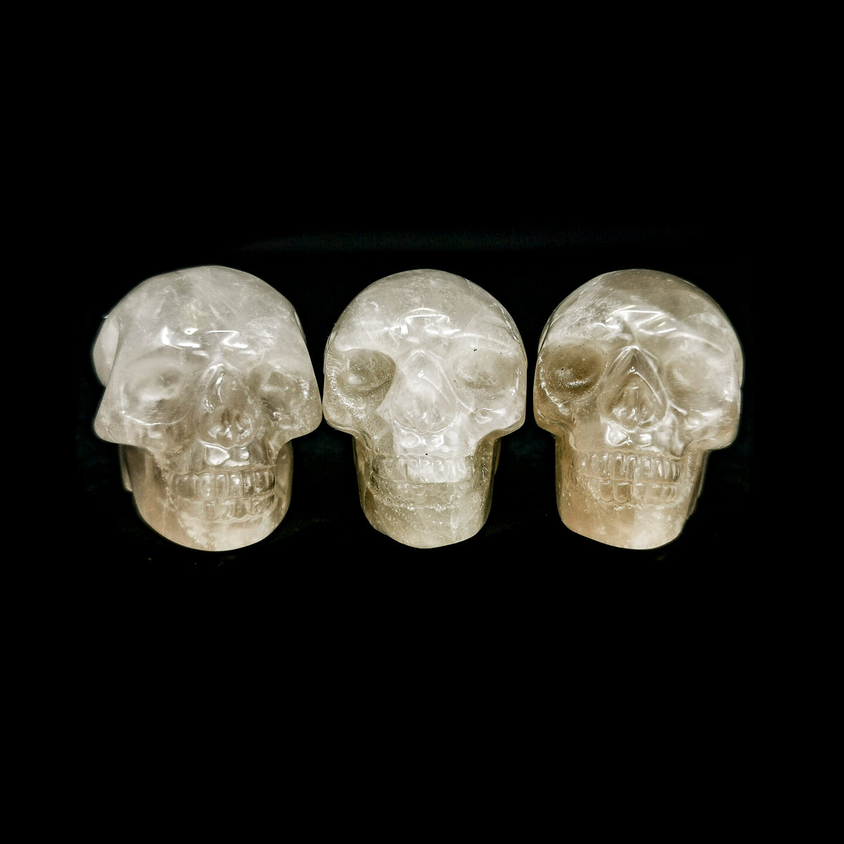Smoky quartz skull: three skulls facing forward