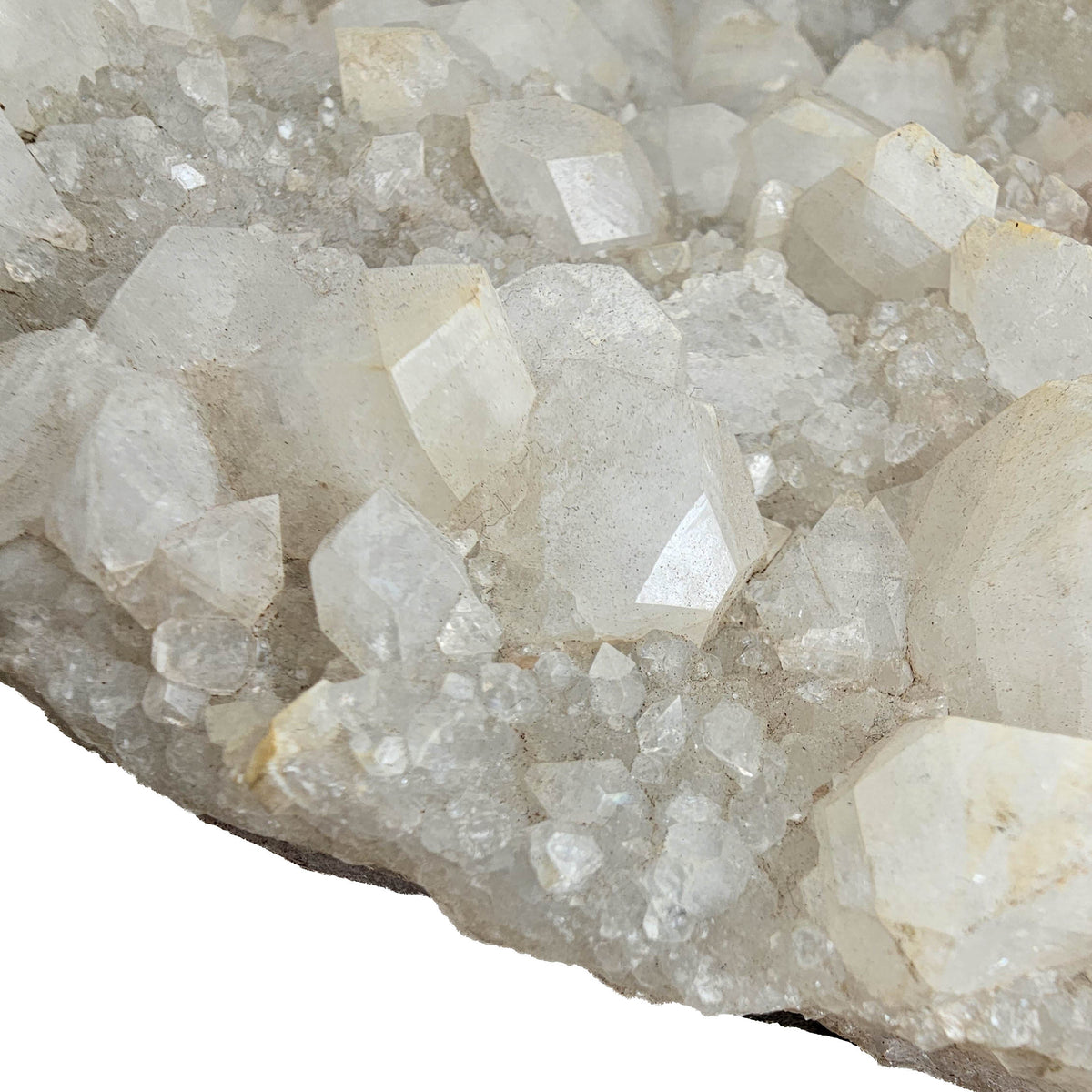 Apophyllite on quartz specimen from Maharashtra, India – close-up of glassy apophyllite crystals on druzy quartz