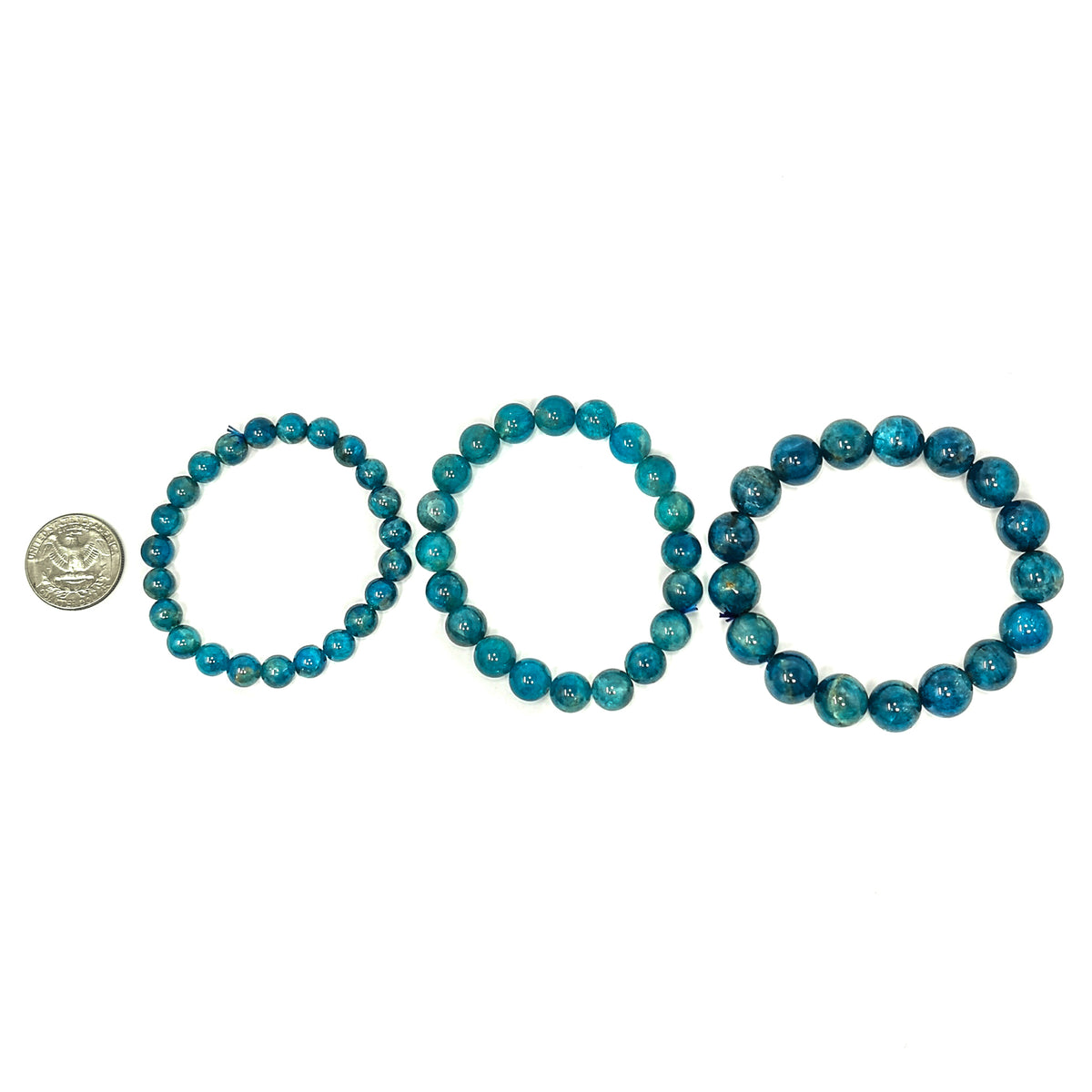 Blue apatite round bead bracelet – three bracelets beside a coin