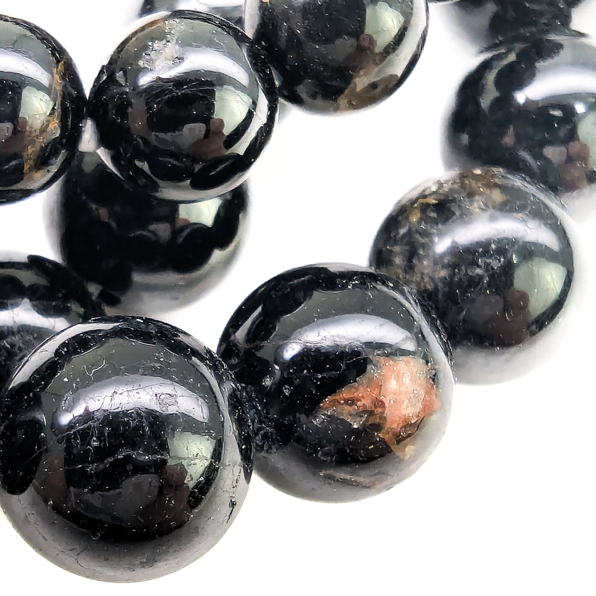 Black tourmaline bead bracelet: macro of glossy beads