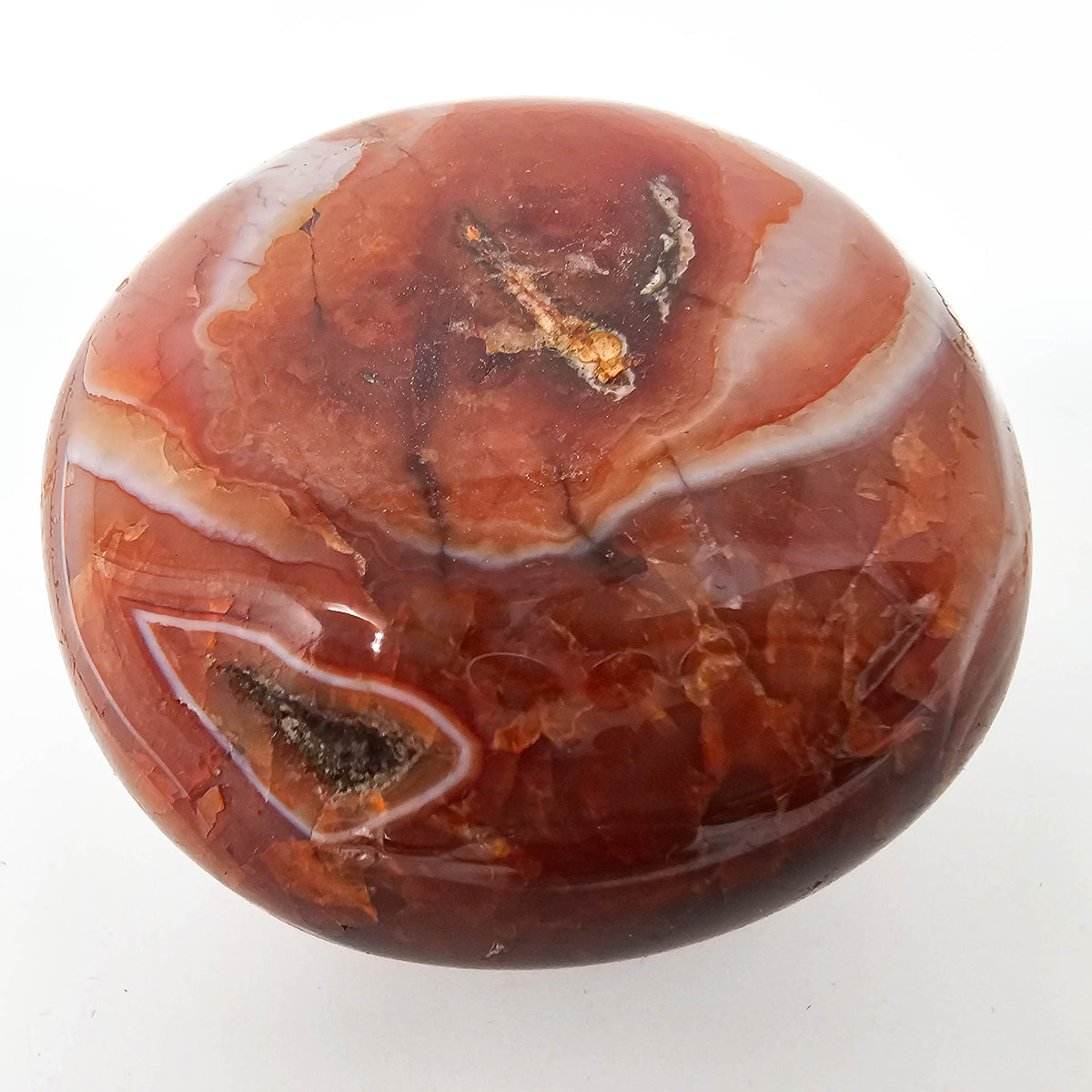 Carnelian palmstone, a variety of chalcedony, from Madagascar.