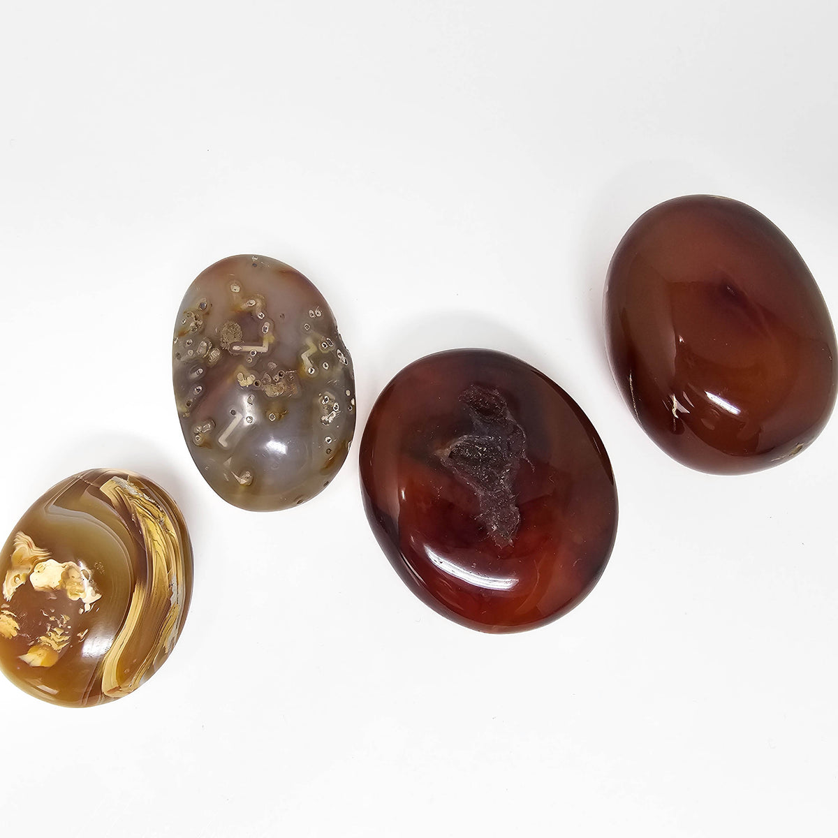 Carnelian palmstone, a variety of chalcedony, from Madagascar.