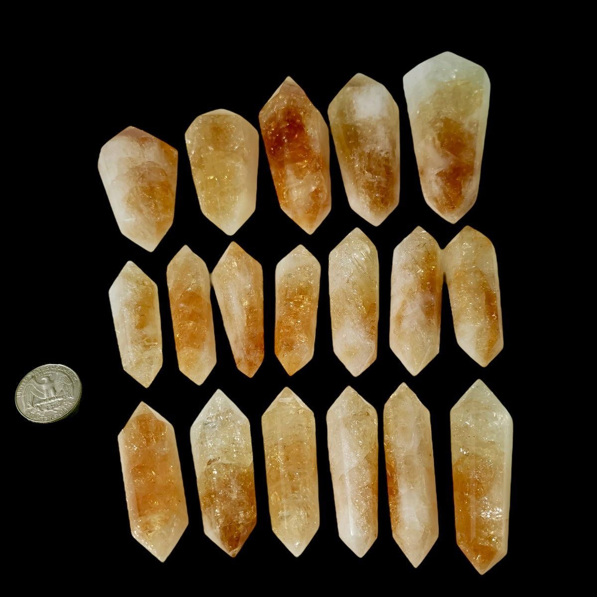 Citrine Vogel wand, Brazil: sizes arranged beside a coin