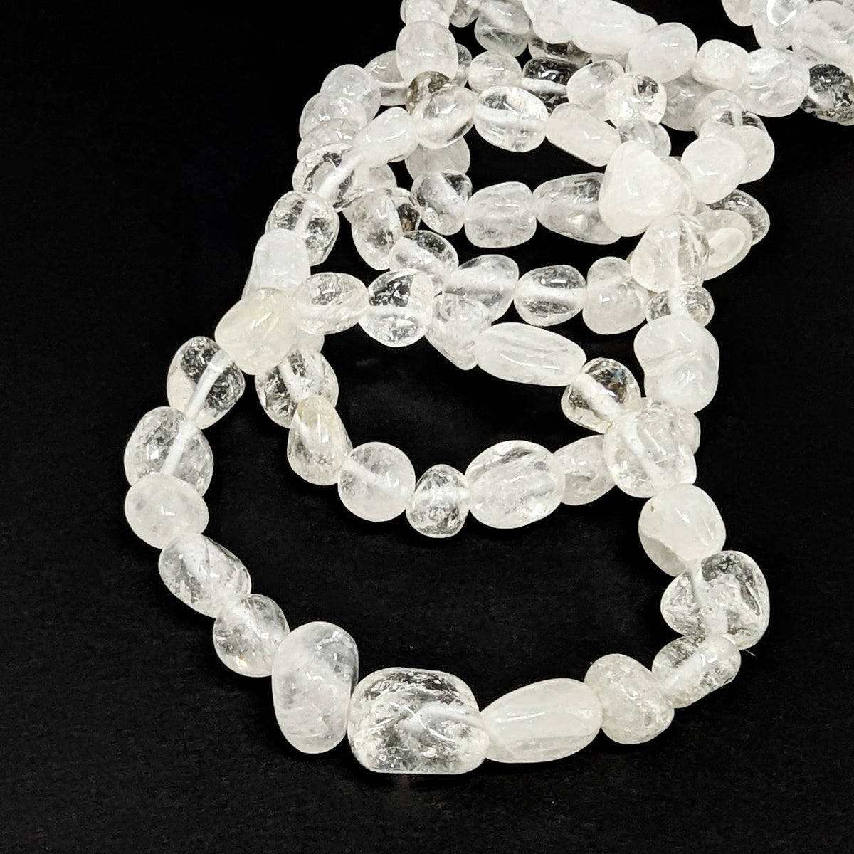 Clear quartz tumble bead bracelet – stack, angled view