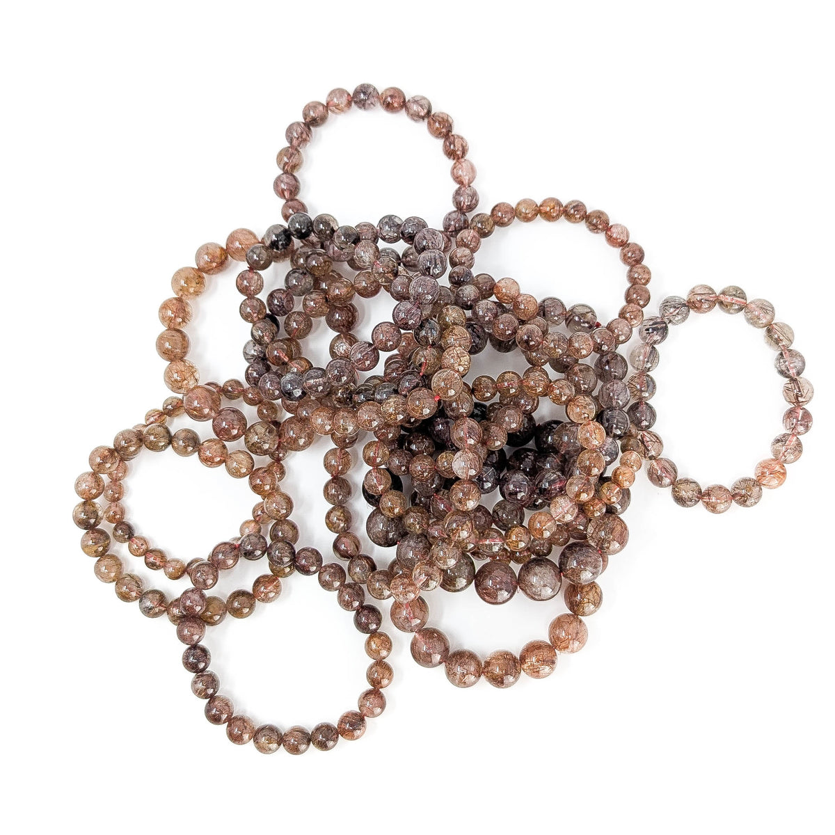 Copper rutile in quartz bead bracelet from Brazil – pile of bracelets, top view
