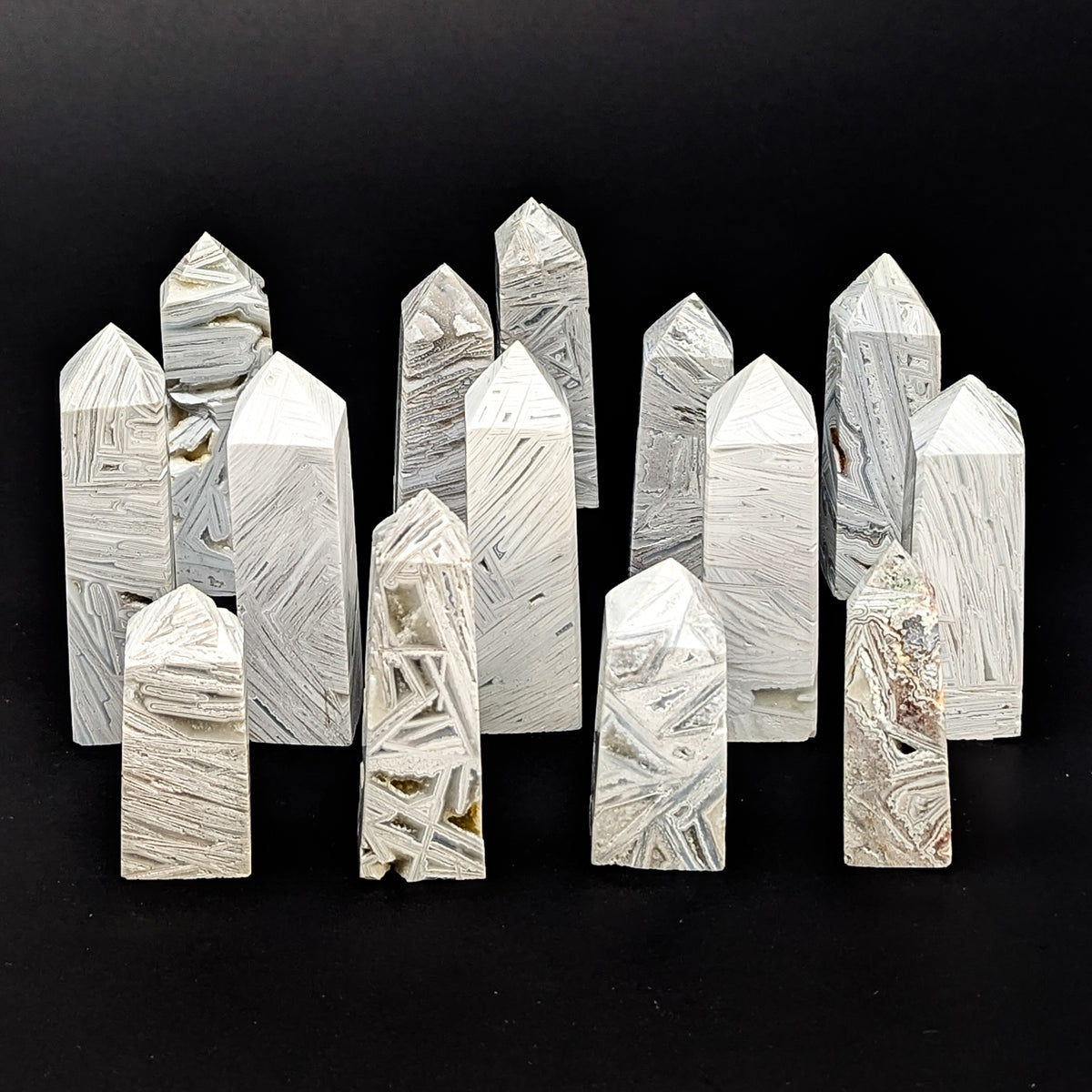 Crazy Lace Agate obelisk, a variety of chalcedony, from Mexico.