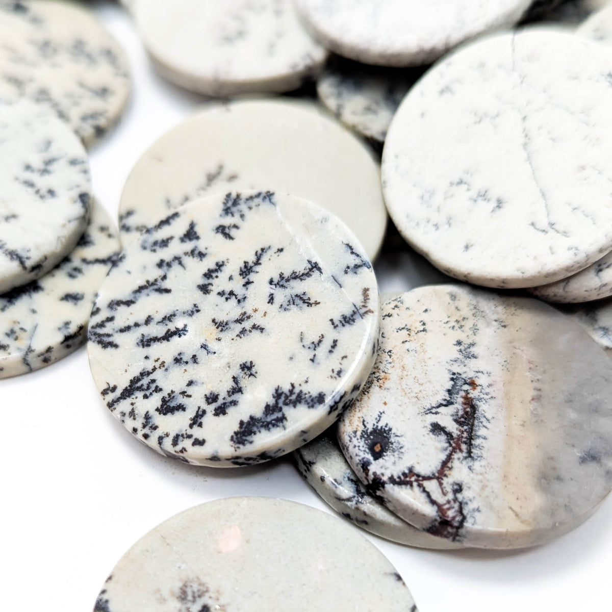 Dendritic Agate flat disk, a variety of chalcedony.