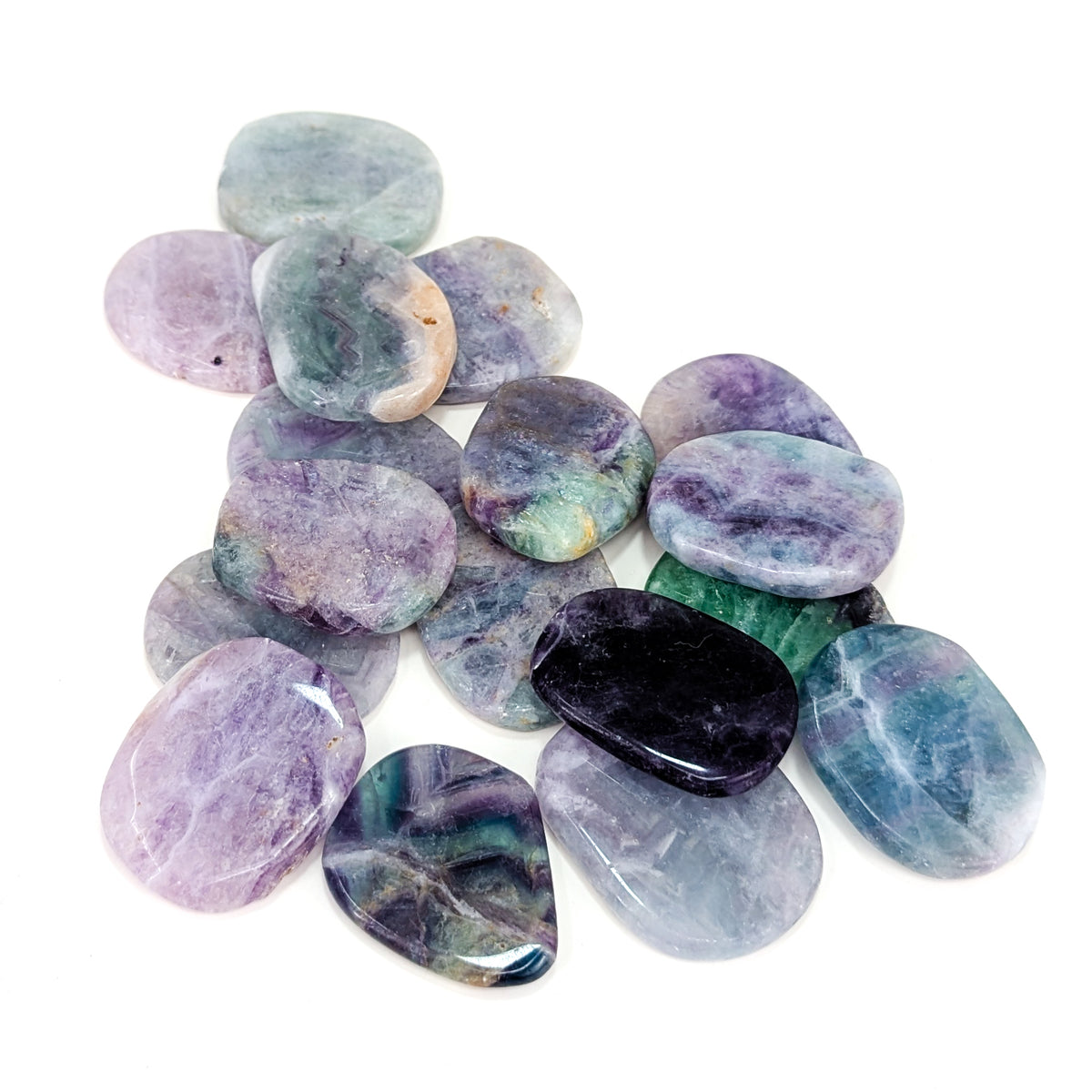 Large fluorite flat tumble from China – spread of stones