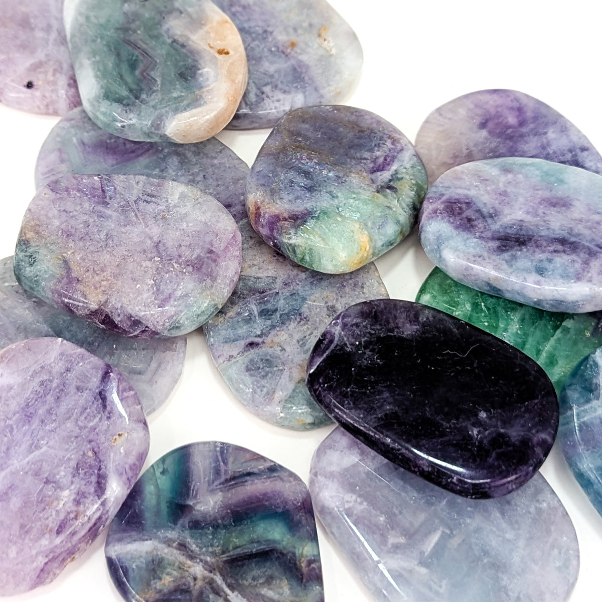 Large fluorite flat tumble from China – pile of stones