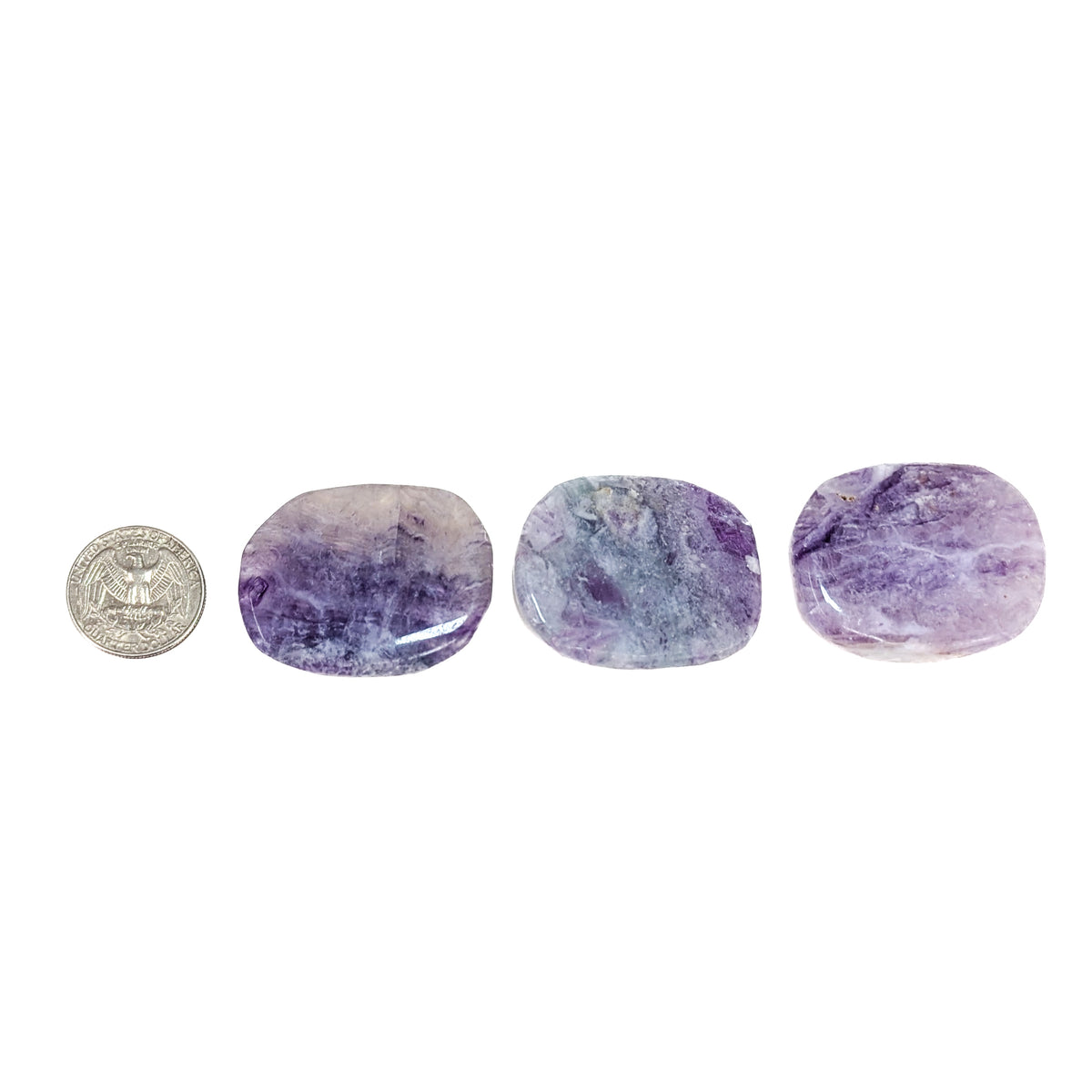 Large fluorite flat tumble from China – three stones beside a coin for scale