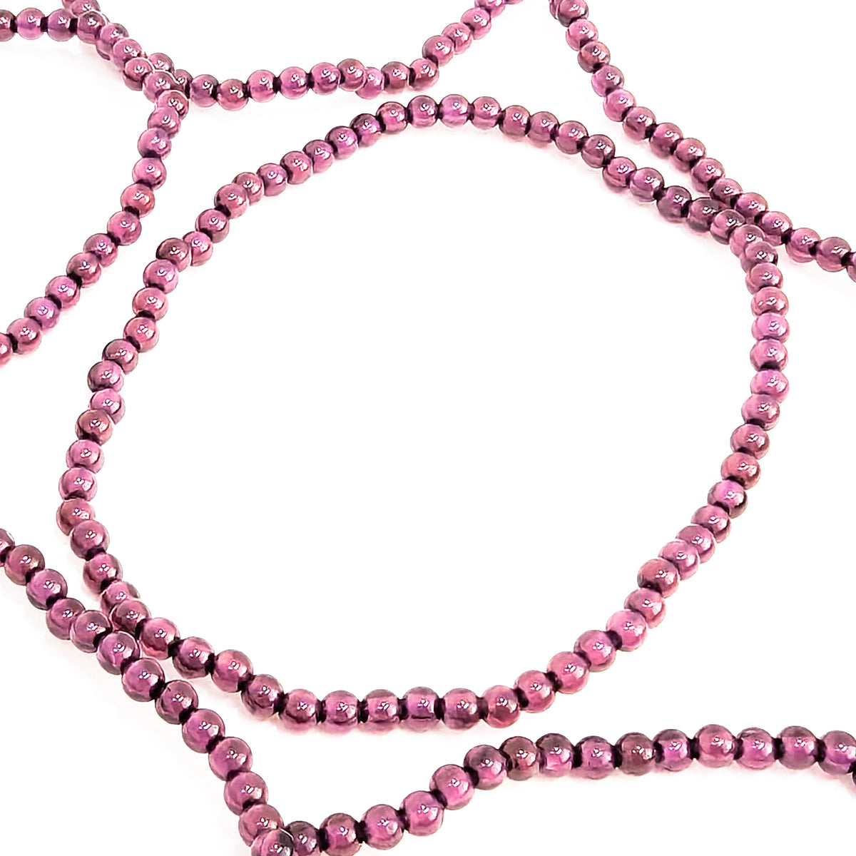 Rhodolite garnet round bead bracelet – spread of bracelets