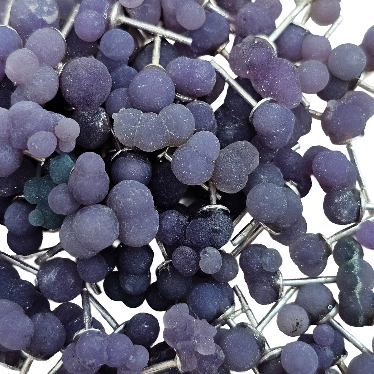 Grape agate stud earring from Indonesia – close-up of a pile of studs