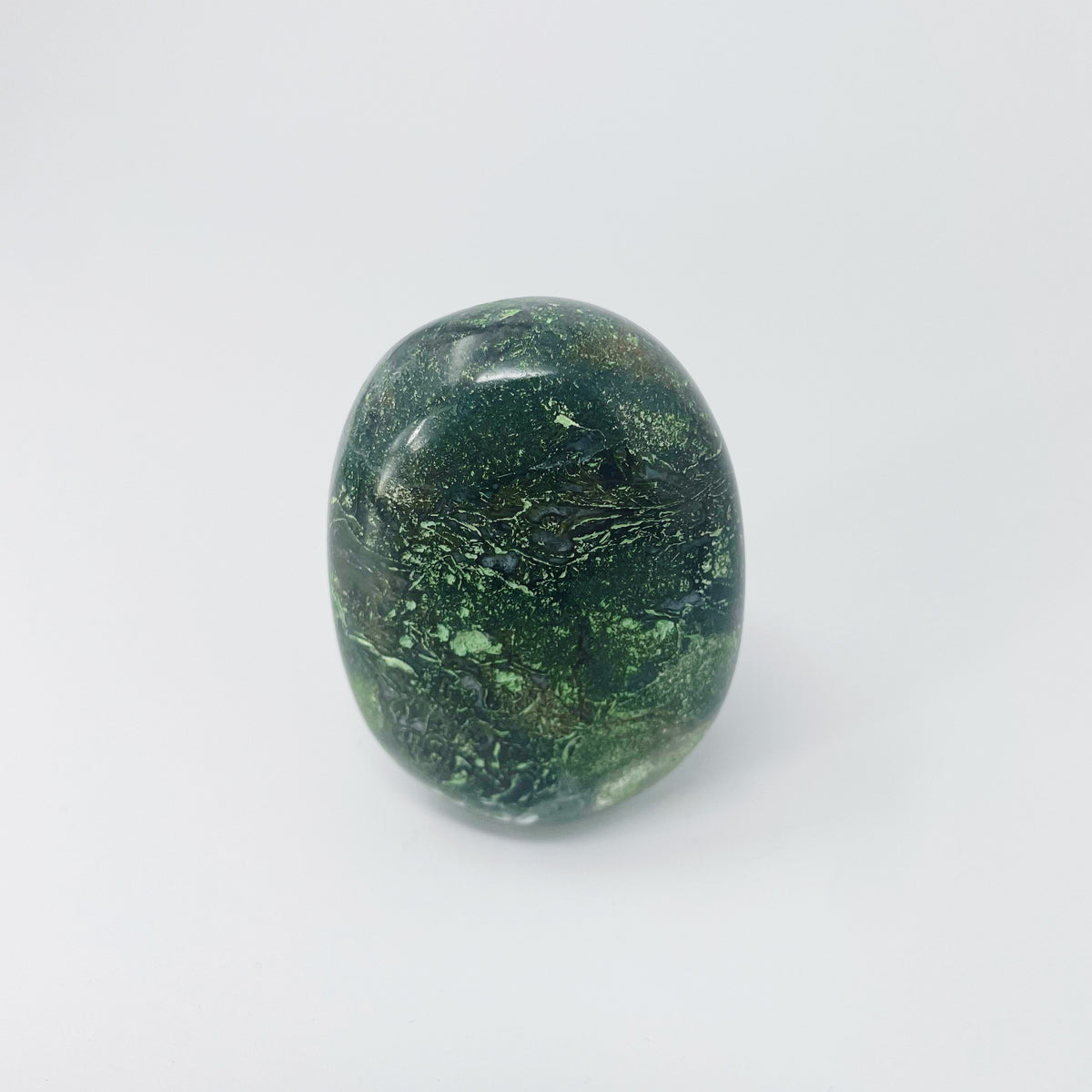 Moss Agate palm stone, a variety of chalcedony, from India.