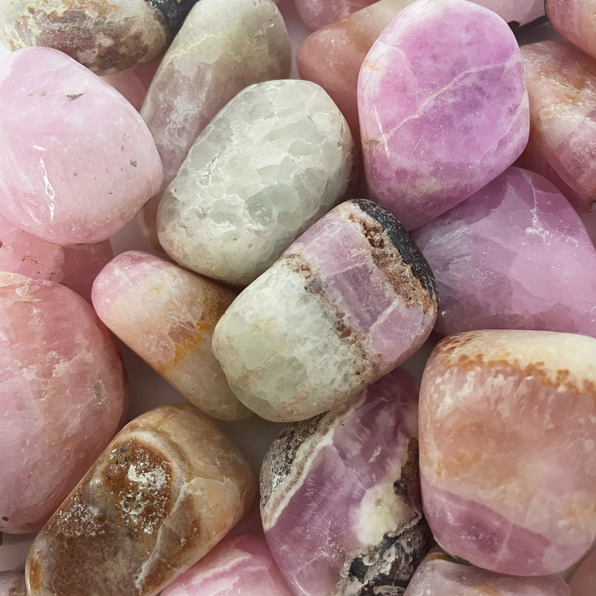 Pink Calcite tumble, calcium carbonate.