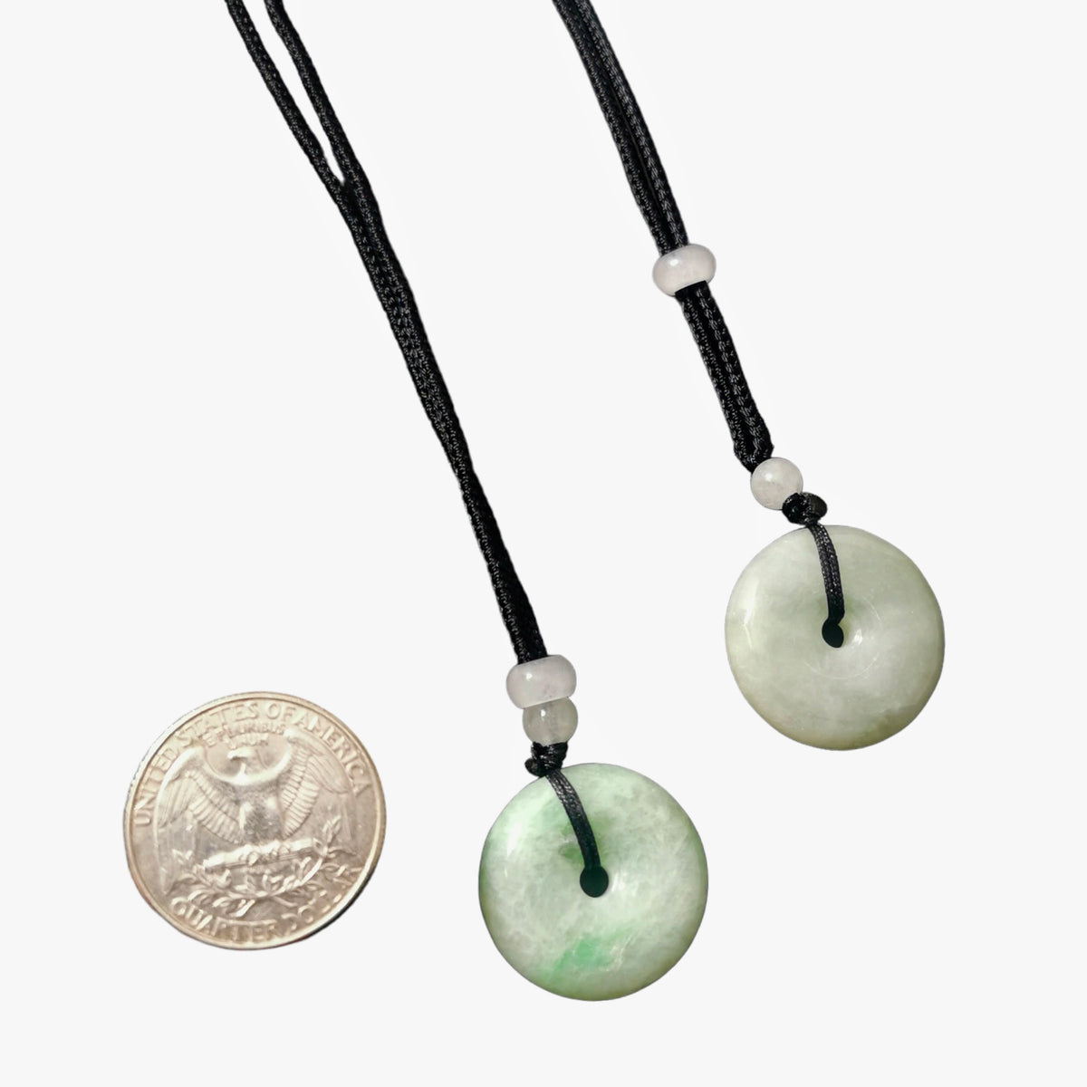 Jadeite bi-disc necklace: two discs beside a coin