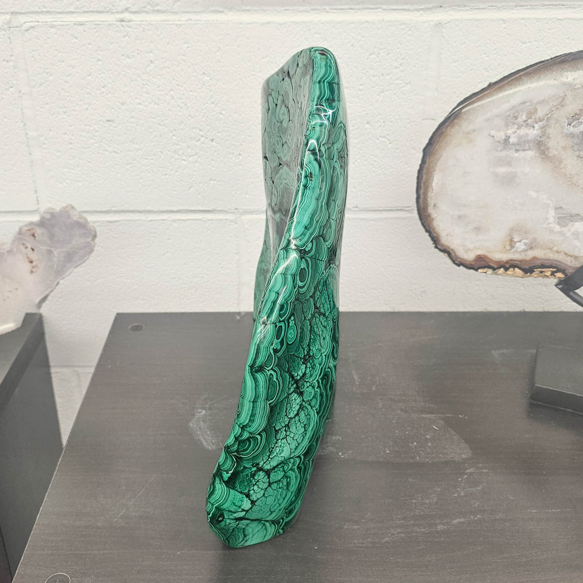 Malachite polished statement specimen, a copper carbonate.