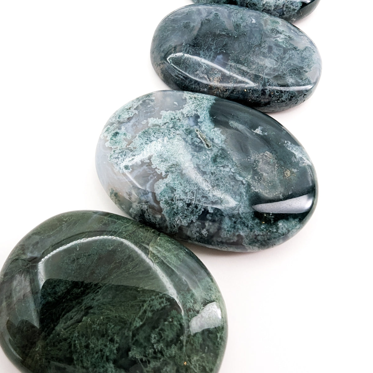 Moss Agate worry stone, a variety of chalcedony, from India.
