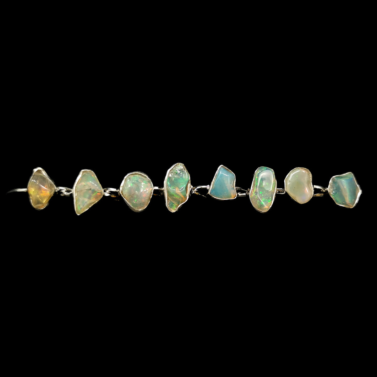 Ethiopian opal freeform ring: row of opal rings