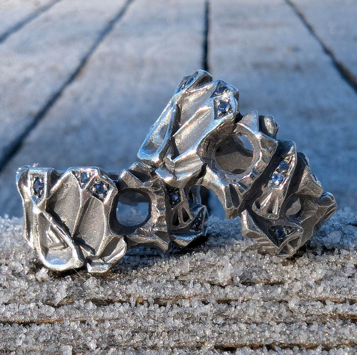 Hydrus free flow ring with Blue Sapphire.