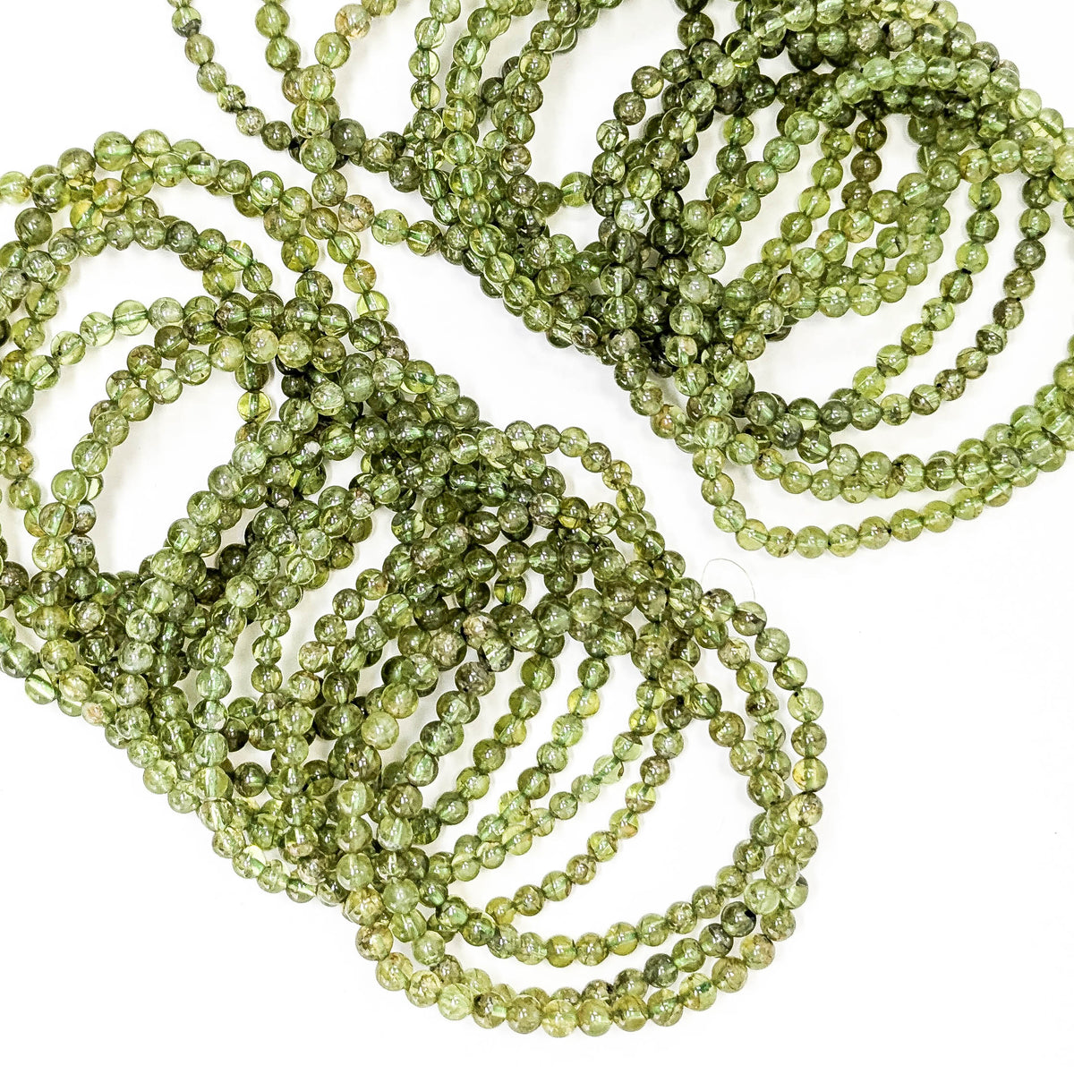 Peridot bead bracelet – close-up of a stack