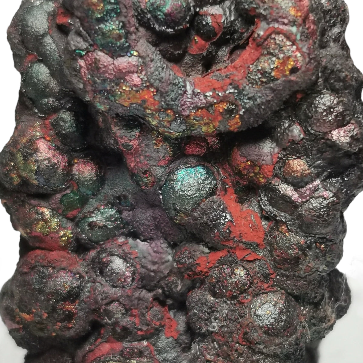 Iridescent goethite from Tharsis, Spain – close-up of botryoidal iridescent surface