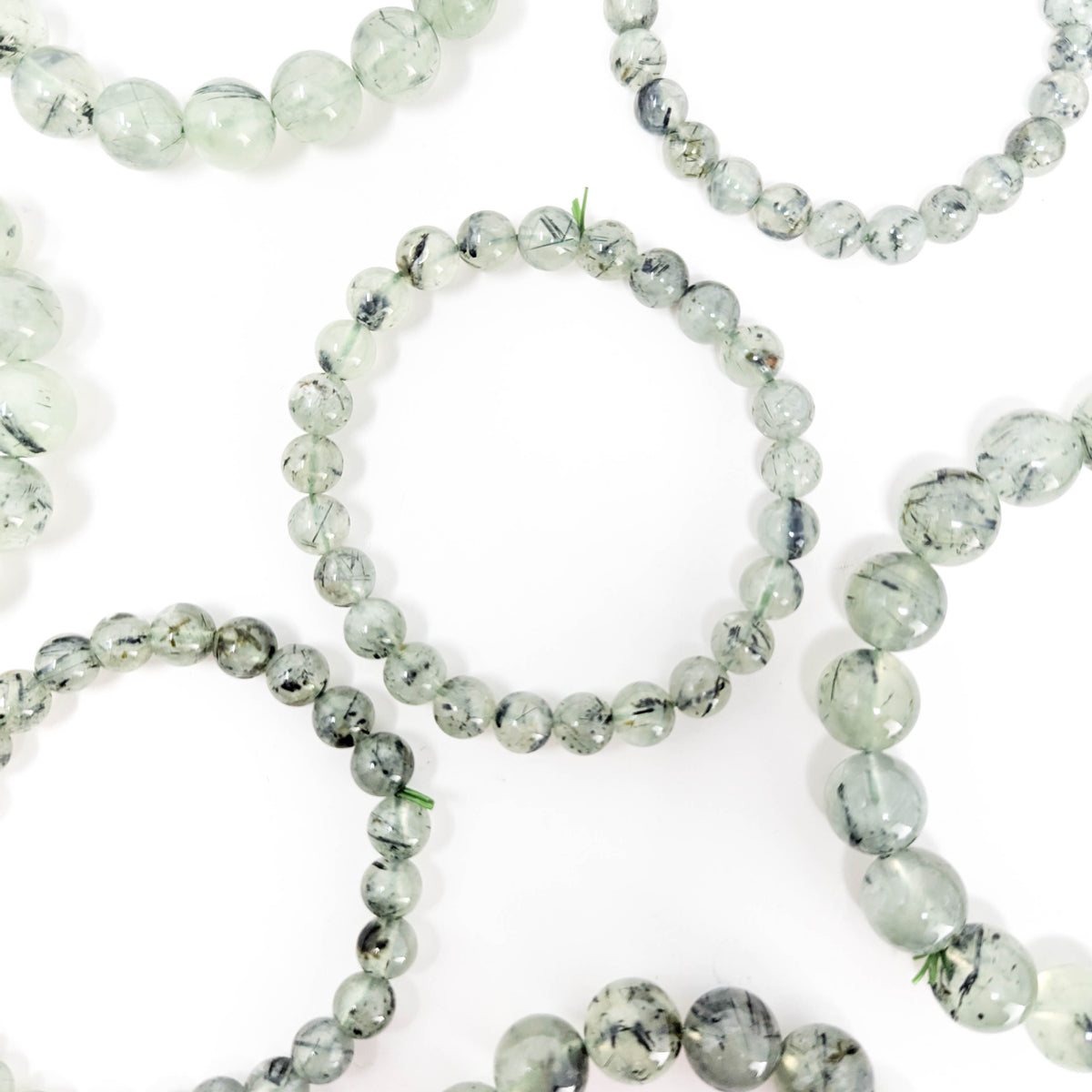 Prehnite with tourmaline bracelet: bracelet on display