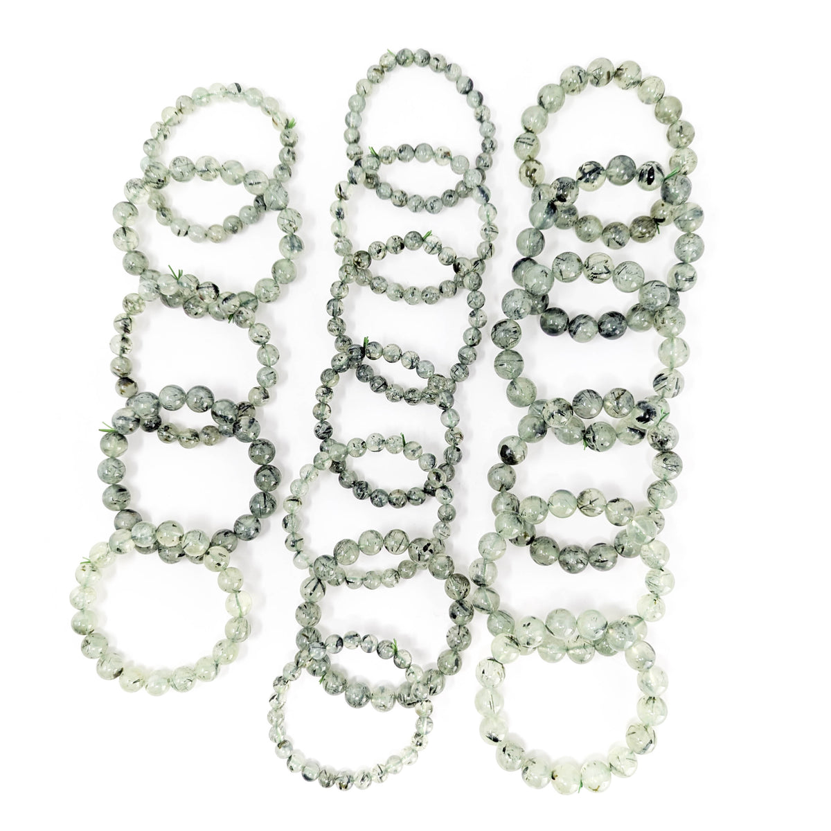 Prehnite with tourmaline bracelet: tourmaline needles close up