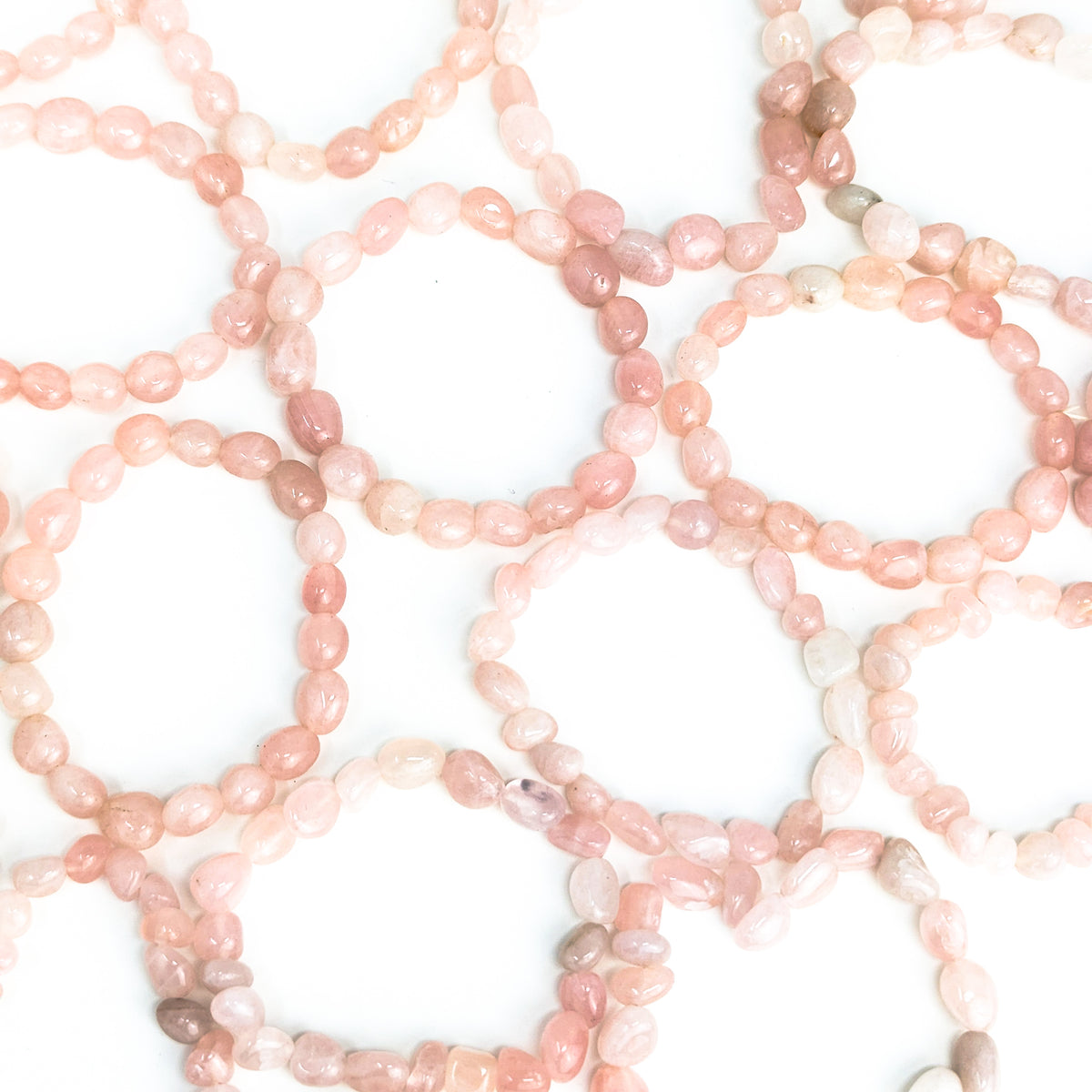 Rose quartz tumbled bead bracelet – many bracelets spread out
