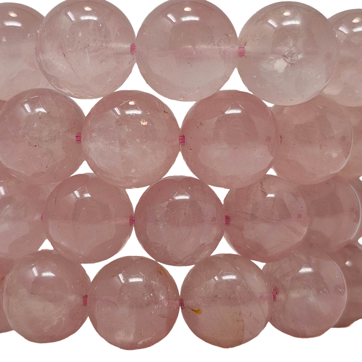 Rose quartz A grade bead bracelet from Brazil – close-up of rows of polished beads