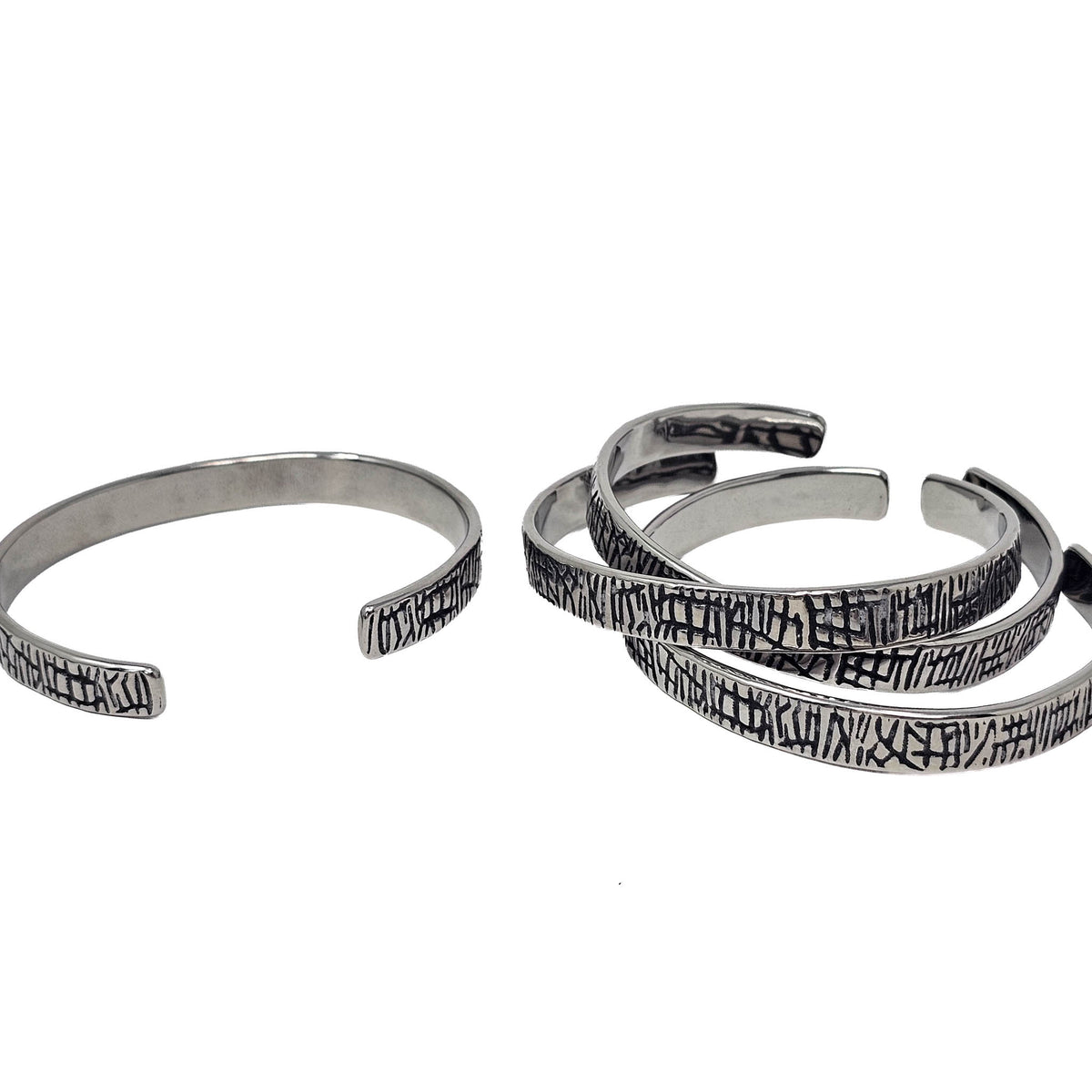 Scored Line stainless steel cuff bracelet.