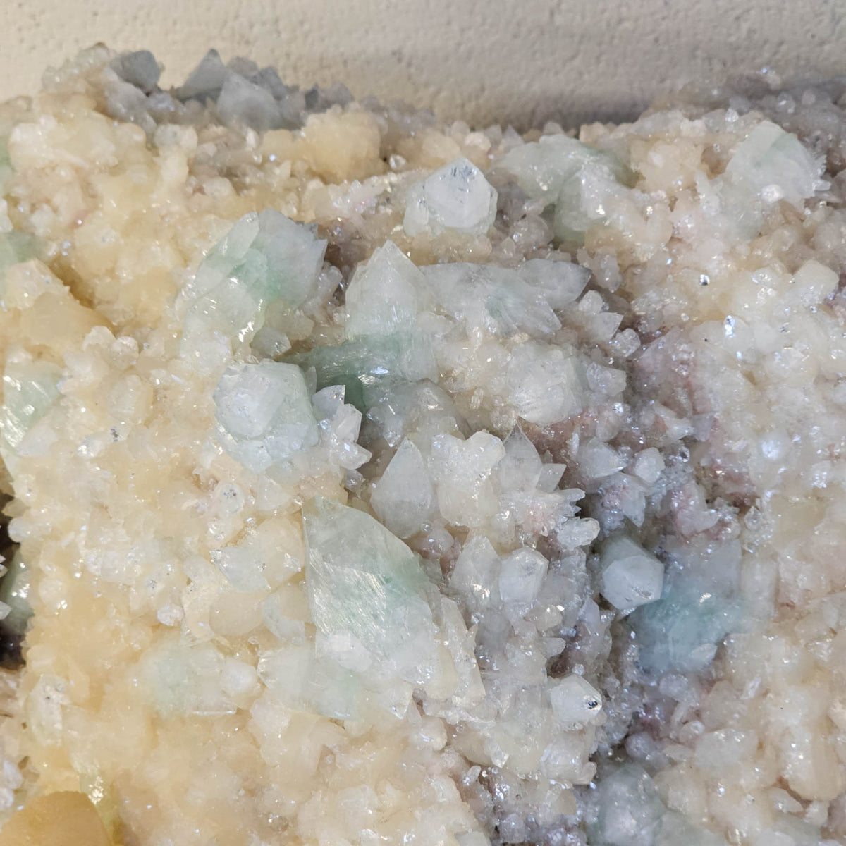 Stilbite with green apophyllite crystal cluster from Pune, India – close-up of apophyllite points among stilbite