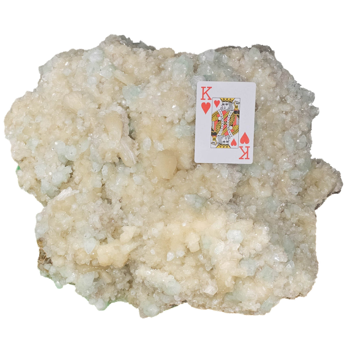 Stilbite with green apophyllite crystal cluster from Pune, India – with a playing card for scale on a white background