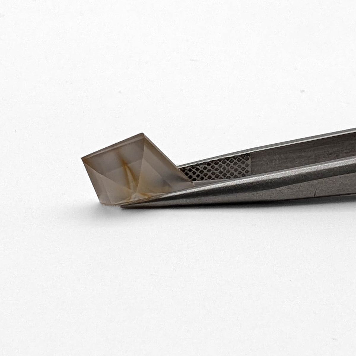 Yellow Banded Agate faceted kite step gemstone, 2.21ct, from BC, Canada, held in tweezers, view 2 of 9