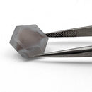 Agate faceted hexagon gemstone, 5.34ct, from BC, Canada, held in tweezers, view 10 of 10