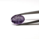 Amethyst faceted oval fantasy cut gemstone held in tweezers, 19.23ct, from Marabá, Pará, Brazil, view 14 of 15