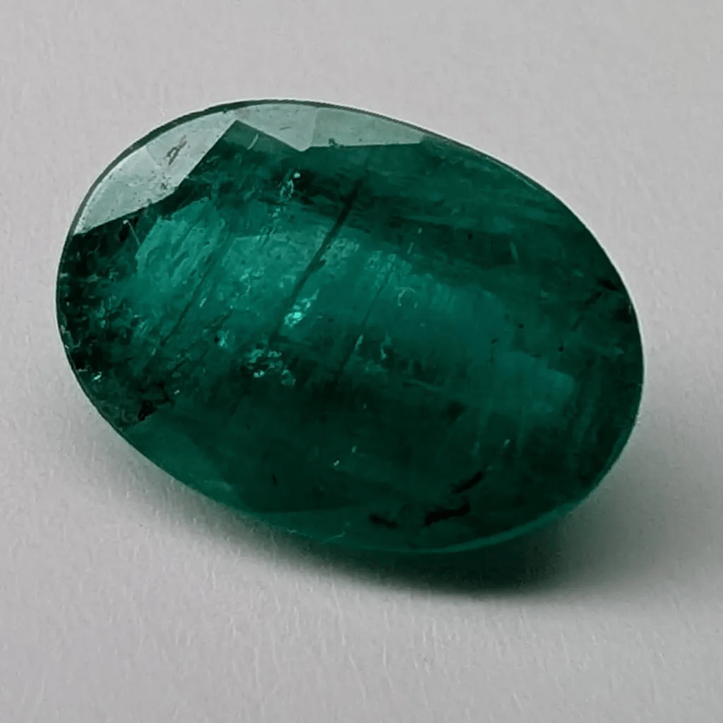 Emerald faceted oval cut gemstone, 2.43ct, rotating view