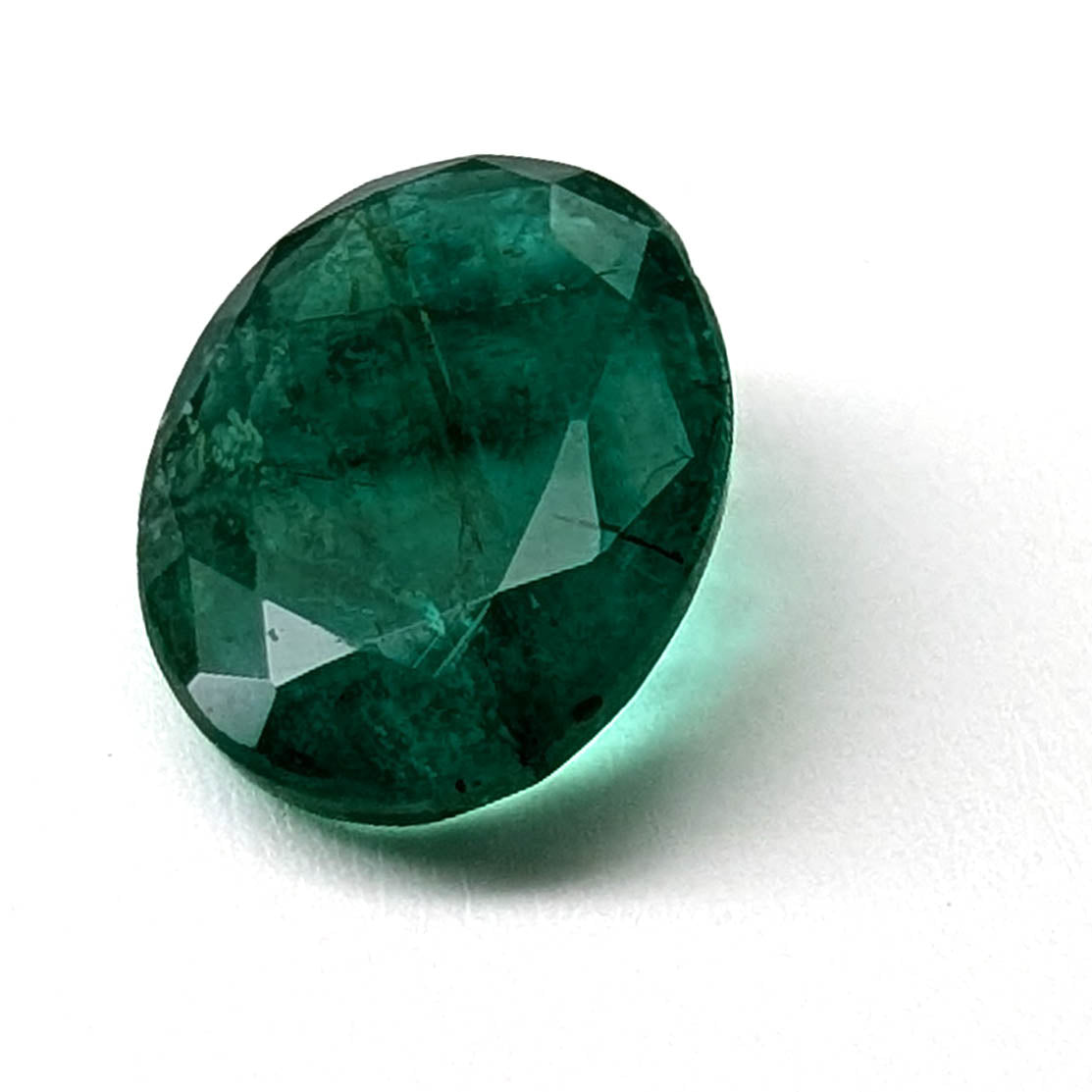 Emerald faceted oval cut gemstone, 3.15ct, main view, view 1 of 13