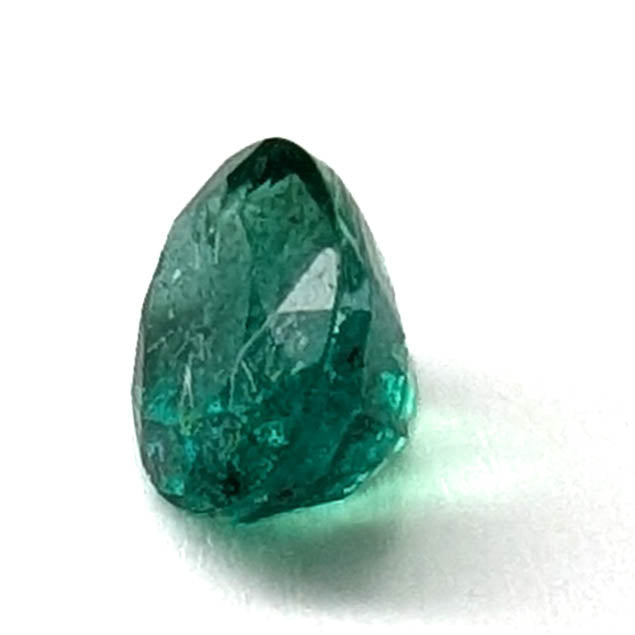 Emerald faceted oval gemstone, 0.73ct, end-on view, view 4 of 10