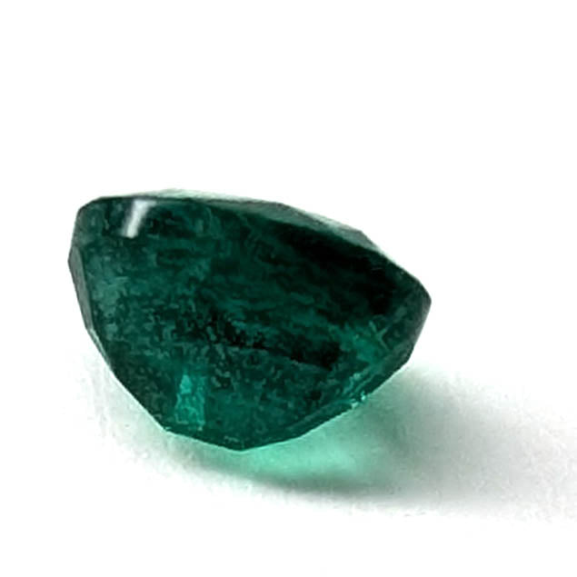 Emerald faceted oval gemstone, 0.73ct, side profile from the other side, view 7 of 10
