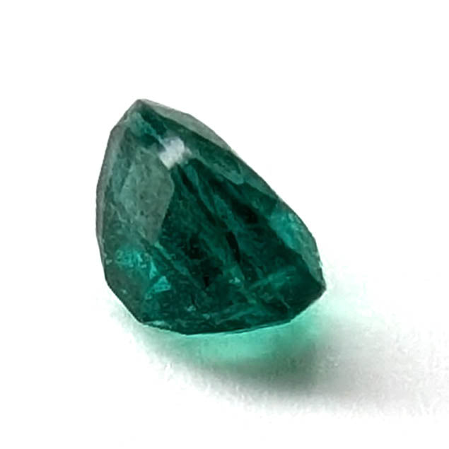 Emerald faceted oval gemstone, 0.73ct, angled view of the pavilion, view 8 of 10